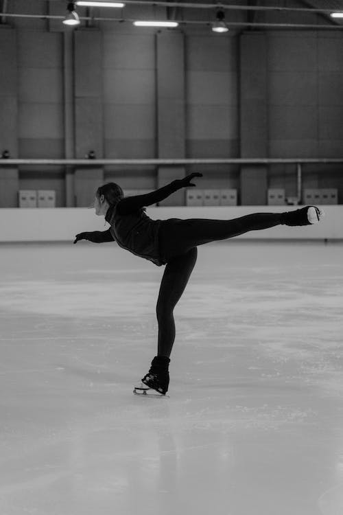 Free Woman Doing Ice Skating in Grayscale Photography  Stock Photo